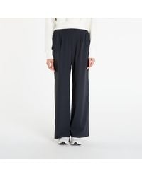 Nike - Pantalons 24.7 perfectstretch dri-fit high-waisted loose wide-leg pants black/ dk smoke grey s - Lyst