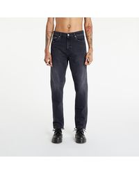 Men's Calvin Klein Tapered jeans from $79 | Lyst