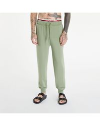 Tommy Hilfiger - Logo Tape Track Joggers Green - Lyst