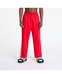 adidas Originals - Sweatbroeken Adidas Adicolor Baggy Fit Firebird Track Pants Better Scarlet/ Medium Heather - Lyst