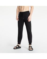 Pantaloni da jogging Tommy Hilfiger da uomo - Fino al 51% di sconto | Lyst