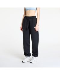 Nike - Pantalon de survêtement sportswear phoenix fleece high-waisted oversized sweatpants black/ sail m - Lyst