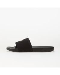 Calvin Klein - Baskets ess slide canvas hdw eur 37 - Lyst