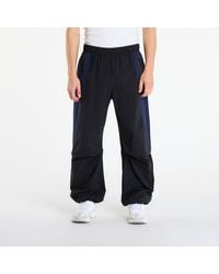 Nike - Broeken Tech Dri-Fit Woven Color-Block Oversized Pants/ Obsidian - Lyst