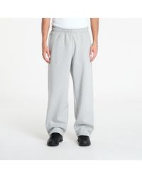 Nike - Pantaloni Solo Swoosh Fleece Open-Hem Pants Dk Heather/ Lt Smoke - Lyst
