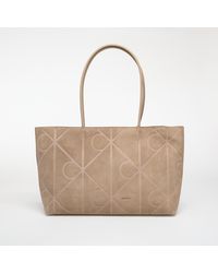 Calvin Klein - Borsa Emblem Aop Embossed Suede Tote - Lyst