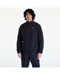 Nike - Veste x nocta woven track jacket black/ black/ white m - Lyst