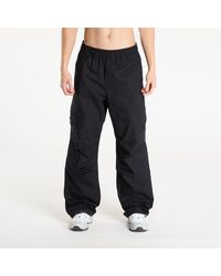 Nike - Pantalons flight utility pants black/ black s - Lyst