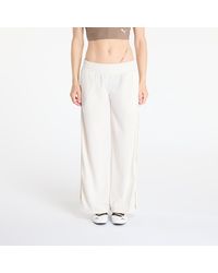 PUMA - Pants Wardrobe Essentials Low Rise Popper Pants - Lyst