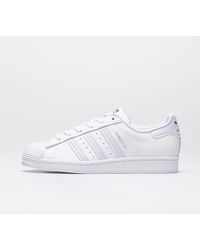 white and purple adidas superstars