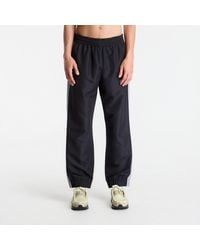 New Balance - Broeken Trackside Woven Pant/ Slate - Lyst