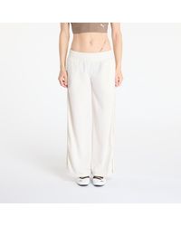 PUMA - Pants Wardrobe Essentials Low Rise Popper Pants - Lyst