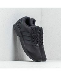 black adidas shoes flux