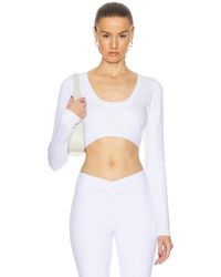 Alo Yoga - Seamless Ribbed Cropped Serene Long Sleeve Top - Lyst