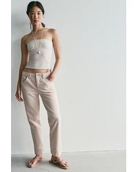 Free People - Leona Low-Rise Twisted Slim Jeans - Lyst