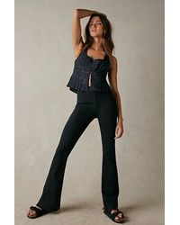 Free People - Level Up Slit Slim Flare Jeans At Free People In Pitch Black, Size: 32 - Lyst