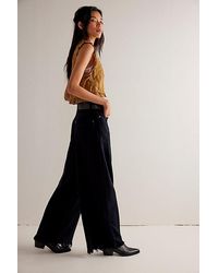 Free People - Old West Slouchy Jeans At Free People In Blue Black, Size: 24 - Lyst
