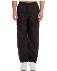 Pantaloni casual, eleganti e chino Versace Jeans Couture da uomo - Fino al  70% di sconto | Lyst