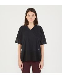 Nike T-shirt de sport ample Dri Fit et empiècement maille filet - Noir