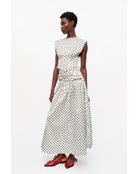 Ganni Polka-Dot Double Satin Long Pocket Skirt in White | Lyst