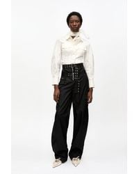 Ganni - Schwarze Duchesse-Hose Mit Taschen - Lyst