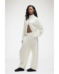 Ganni - X Lululemon Ruffle-Trim Textured Mr Pants - Lyst