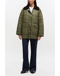 Ganni - Shiny Quilt Midi Jacket - Lyst