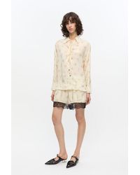 Ganni - Cremefarbene Geblümte Shorts Mit Gummizug - Lyst