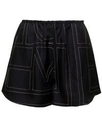 TOTEME - Shorts With Geometric Logo Print - Lyst