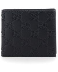 Gucci - 'Emblem' Bi-Fold Wallet With Embossed Gg Motif - Lyst