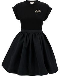 Alexander McQueen - Mini Black Dress With Flared Skirt And Embroidered Seal Logo In Cotton - Lyst