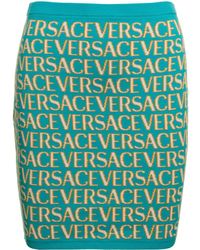 Versace - Gonna corta con motivo 'all-over' jacquard in cotoone stretch azzurro - Lyst