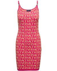 Versace - Mini Fuchsia Dress With All-Over Logo Lettering Print And Medu - Lyst