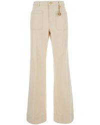 MICHAEL Michael Kors - Cream High-Waisted Jeans With Logo Pendant - Lyst