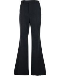 Valentino - Pants With Flared Design And Pleats On Front And Back - Lyst