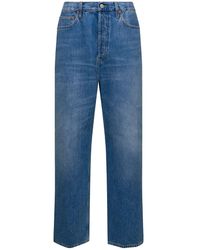 Gucci - Jeans a cinque tasche dritti con patch logo in denim di cotone azzurro - Lyst