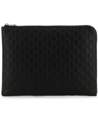 Gucci - Clutch GG Emblem in pelle nera - Lyst