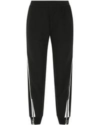 Alexander McQueen Track pants and sweatpants for Women - Up to 53 