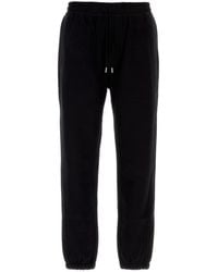 Saint Laurent - Pantalone jogging in cotone nero - Lyst