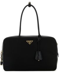 Prada - Borsa a mano nera in pelle e Re-Nylon - Lyst