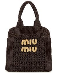 Miu Miu - Borsa shopping in rafia marrone - Lyst