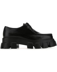 Prada Monolith Brushed Leather And Nylon Lace-up Shoes in Black 