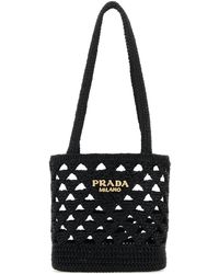 Prada - Borsa a mano in paglia nera - Lyst