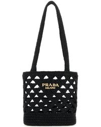 Prada - Borsa a mano in paglia nera - Lyst