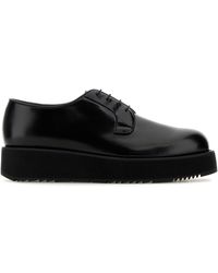 Prada - Scarpe stringate in pelle nera - Lyst