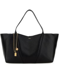 Chloé - Borsa shopping East-West Chloé Spin in pelle nera - Lyst