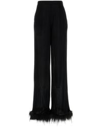 Prada - Pantalone alla gamba ampia in raso nero - Lyst