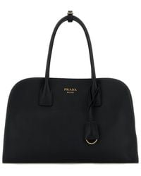 Prada - Borsa shopping media in pelle nera - Lyst