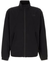 The North Face - Giacca a vento in nylon stretch nero - Lyst