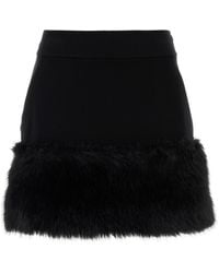 Prada - Minigonna in misto cotone nero - Lyst
